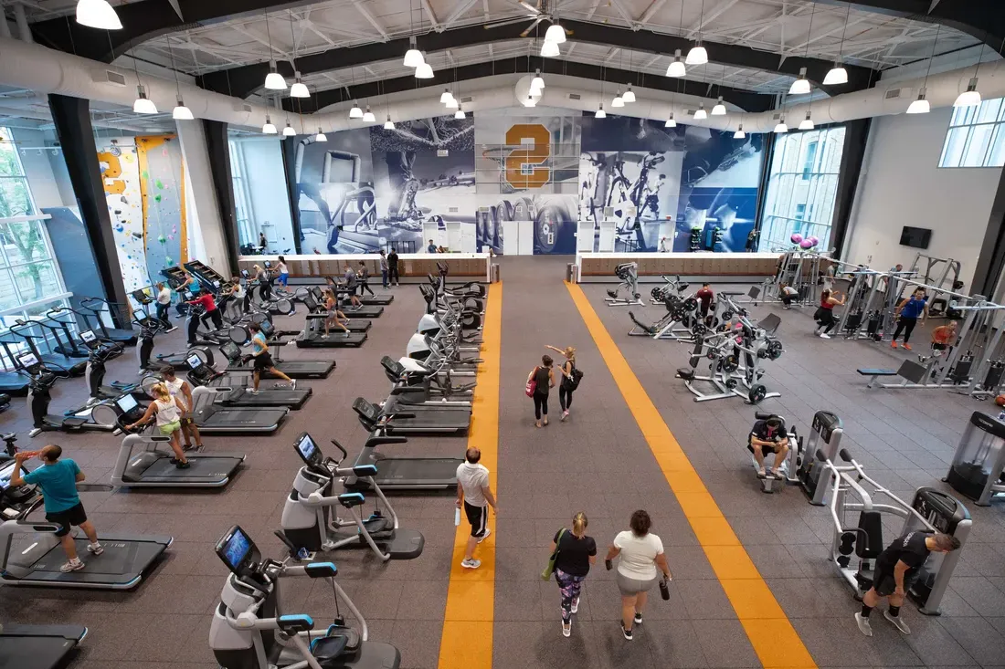 Students utilizing a fitness area within the Barnes Center.